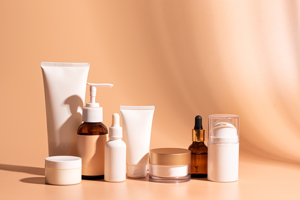 Various,Cosmetic,Products,Containers,And,Bottles,On,Beige,Orange,Background,